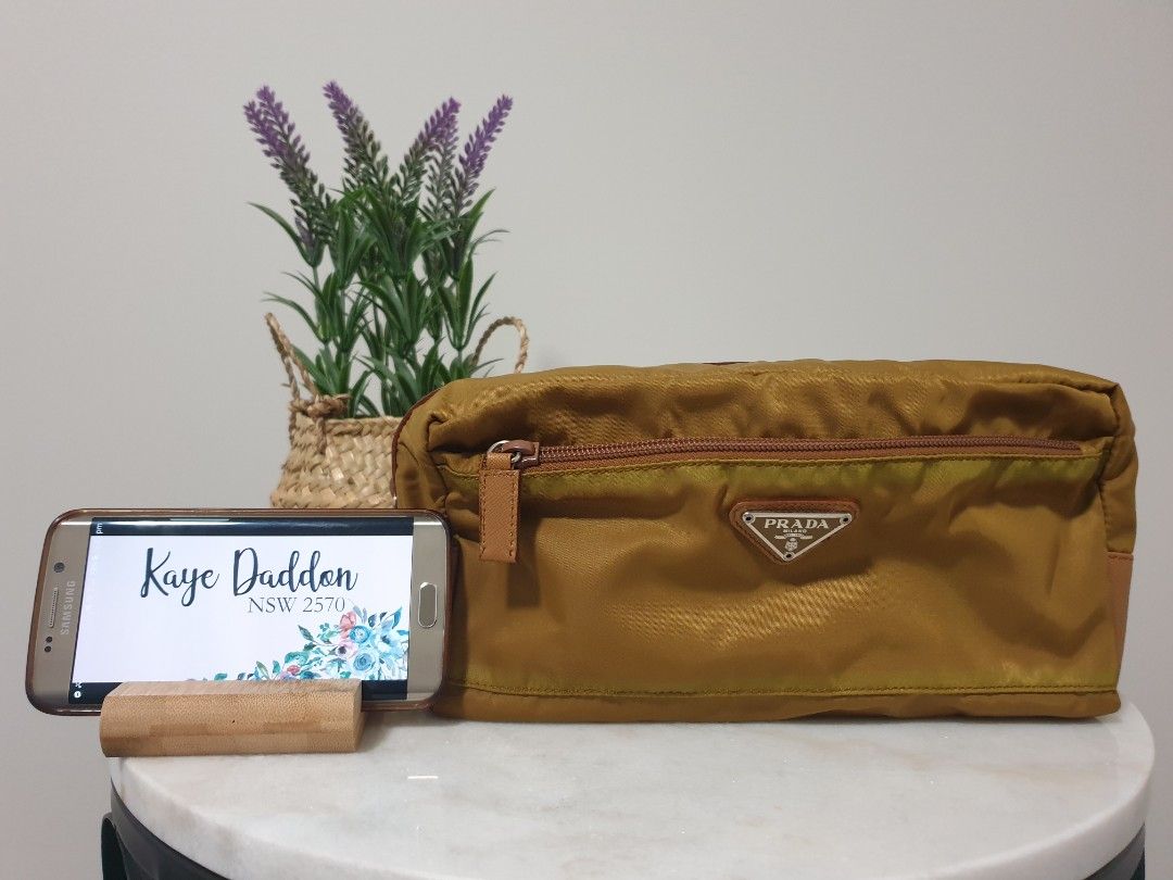Authentic Prada Re-Nylon and Saffiano Leather Travel Pouch (Category: Bags & Wallets) located in Campbelltown. Submitted by kaye_daddon (Listing ID 1243152237, Image 1). Description: 💎 Sleek, functional design is made of Re-Nylon 💎 Details: ▫️Made in Italy ▫️Color: Tobaco ▫️Zipper closure ▫️Two external zipper pockets ▫️Nylon lining ▫️ Unisex Dimensions: L 14cm x H 11cm × D 26cm Inclusions: ▫️Authenticity certificate card Rating: Very good ▫️Ou
