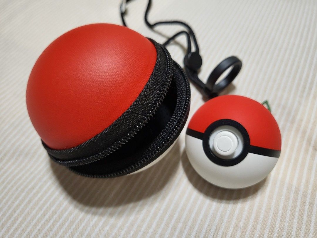 Nintendo Switch Pokeball Plus controller and Pokemon games