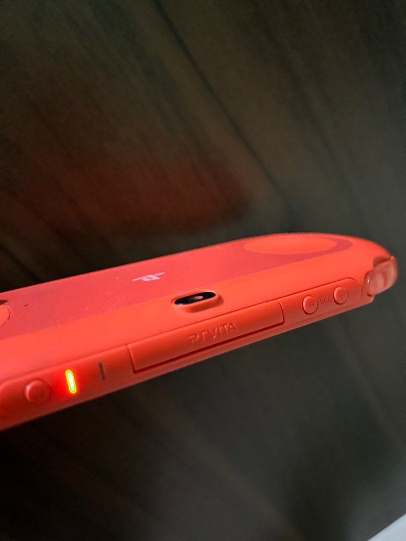 Psvita slim orange like new on Carousell