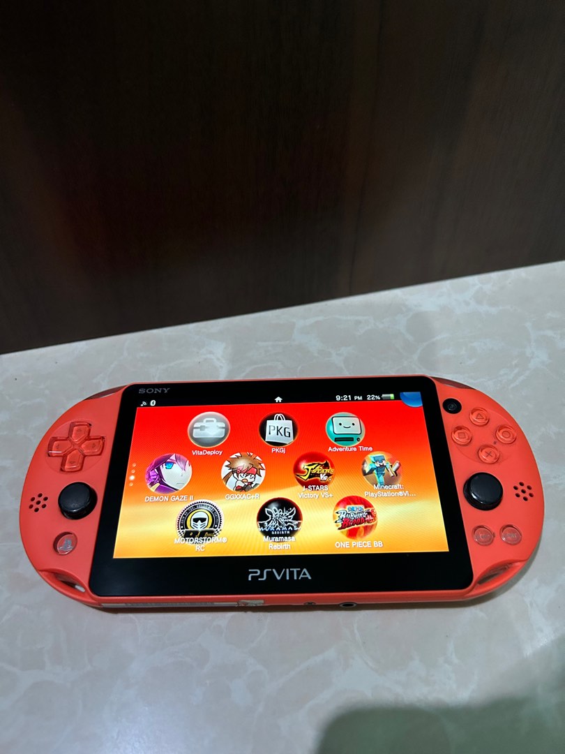 Psvita slim orange like new on Carousell