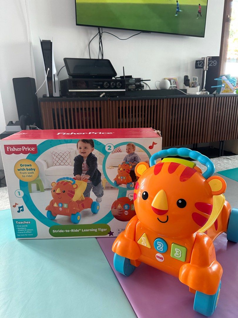 Fisher price stride shop to ride learning tiger