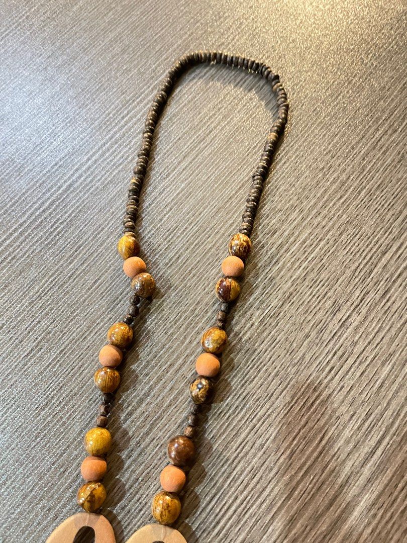 Summer - wood necklace (Category: Necklaces) located in Bulacan. Submitted by boutiquest3112 (Listing ID 1243177974, Image 3). Description: Wood Necklace Perfect for summer outfits Rate: 9/10 Minimal fading on wood.
