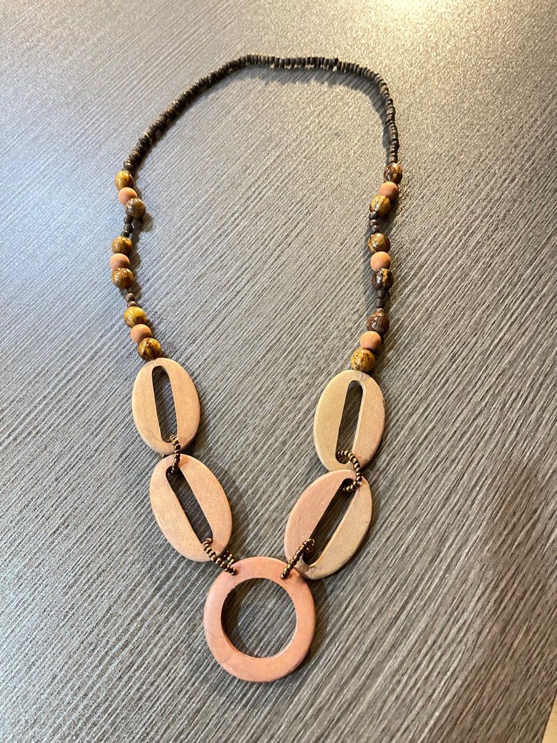 Summer - wood necklace (Category: Necklaces) located in Bulacan. Submitted by boutiquest3112 (Listing ID 1243177974, Image 1). Description: Wood Necklace Perfect for summer outfits Rate: 9/10 Minimal fading on wood.