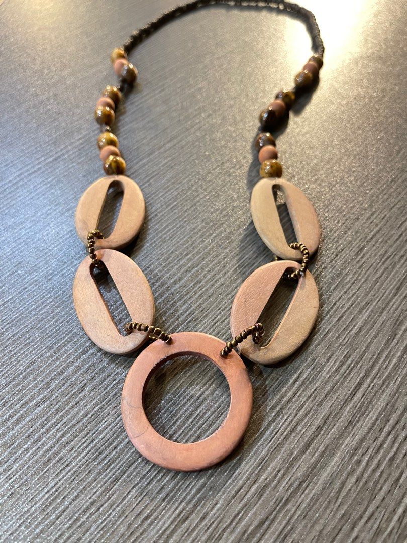 Summer - wood necklace (Category: Necklaces) located in Bulacan. Submitted by boutiquest3112 (Listing ID 1243177974, Image 2). Description: Wood Necklace Perfect for summer outfits Rate: 9/10 Minimal fading on wood.