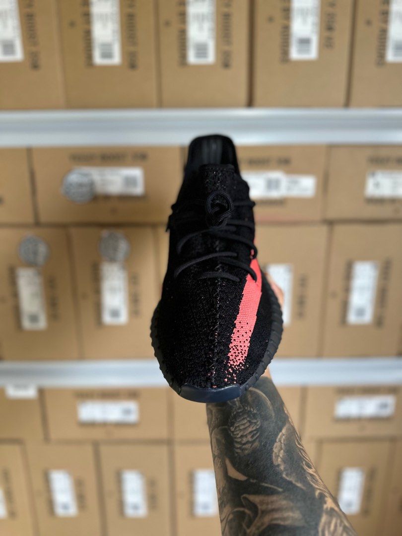 Yeezy red sales stripe on feet
