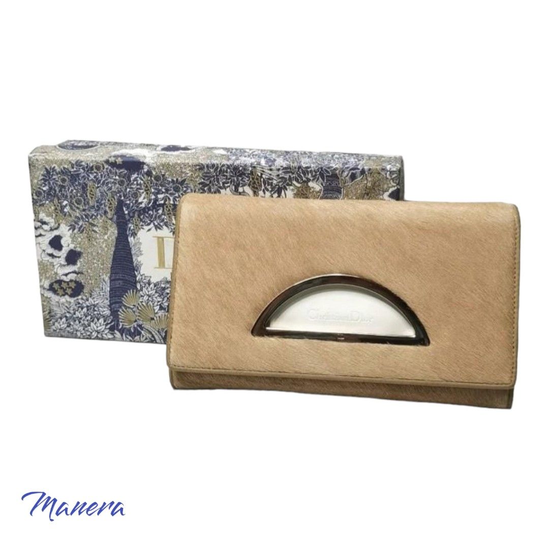 Authentic DIOR Clutch Wallet (Category: Luxury Bags & Wallets) located in Quezon City. Submitted by manerarestorationservices (Listing ID 1243356572, Image 1). Description: Money back Guarantee 💯% Guaranteed authentic *Brand: DIOR Clutch WALLET *Materials: ponny hair *Color: beige *Size: small - medium *Condition: 8/10 Minor flaws in on the photos -Used * Inclusions: box Rank review by the criterion of our shop about the products condition and l