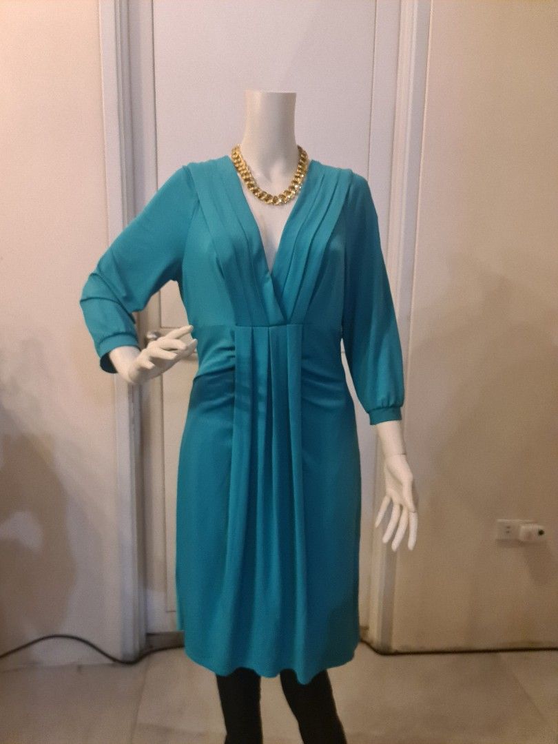 BCBG Teal green v neck dress nwot (Category: Dresses) located in Malabon City. Submitted by mersrufino (Listing ID 1243435829, Image 1). Description: new without tags low v neck drapey stretchy fabric large on tag great for parties shoulder 14 armpit 18 length 40 great deal for an unworn designer piece.