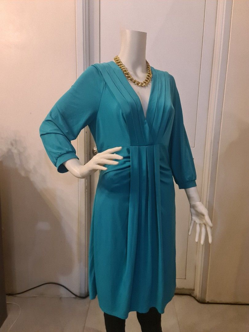 BCBG Teal green v neck dress nwot (Category: Dresses) located in Malabon City. Submitted by mersrufino (Listing ID 1243435829, Image 2). Description: new without tags low v neck drapey stretchy fabric large on tag great for parties shoulder 14 armpit 18 length 40 great deal for an unworn designer piece.