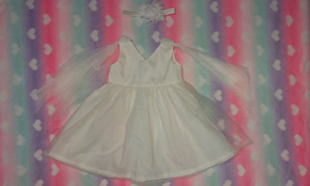 Christening Dress for Babies (Category: Babies & Kids Fashion) located in Solano. Submitted by aivee09mrie (Listing ID 1243358472, Image 2). Description: Little Blessings Christening Baby Dress with hairband Bought for 1500 sa mall Never nagamit No flaw Size 12 months Need laba lang at na stock lang.