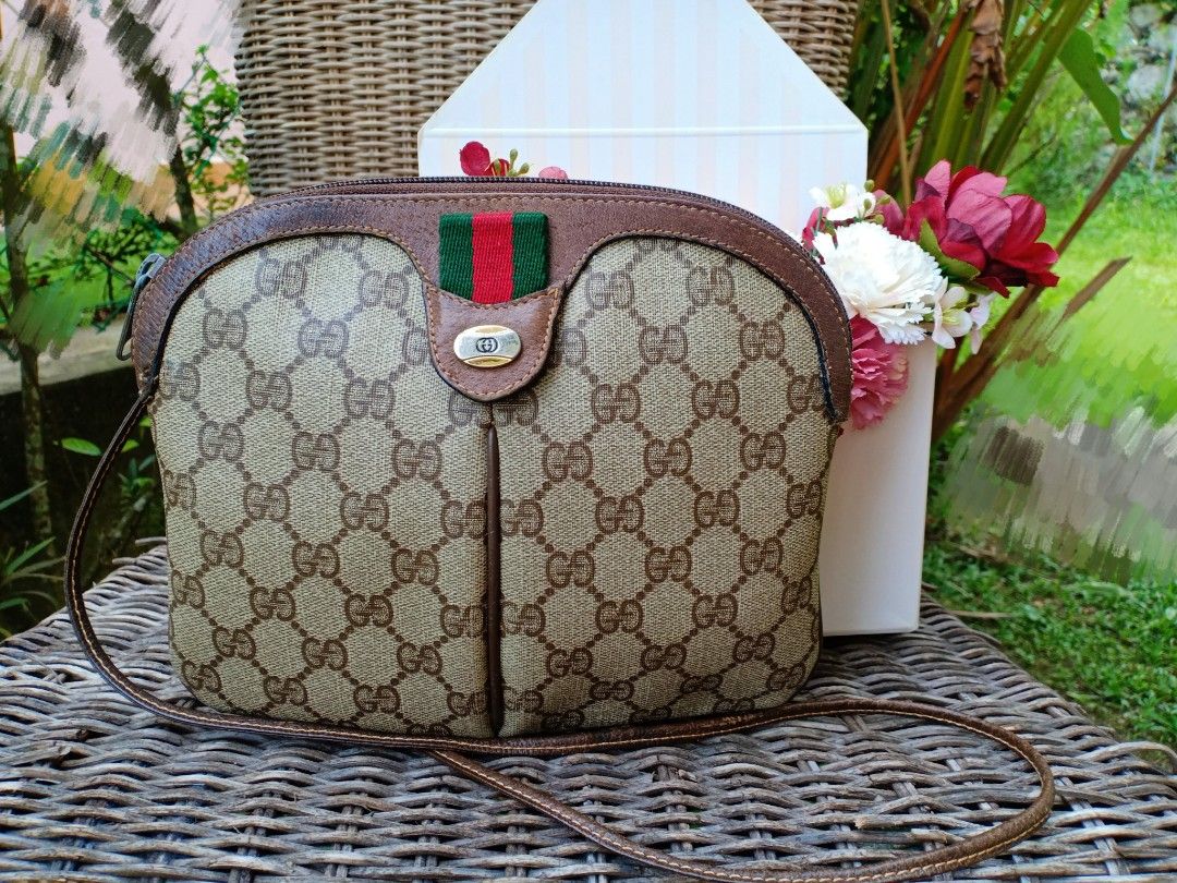 Gucci Large GG Logo Beige Canvas Brown Leather Strap Duffle Bag – Queen Bee  of Beverly Hills