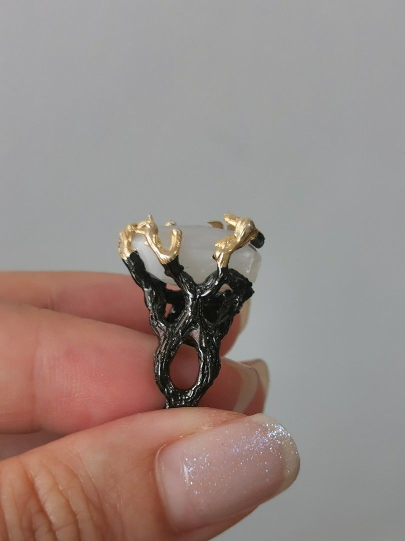 Statement Moonstone Ring (Category: Rings) located in Singapore. Submitted by shopwithtt (Listing ID 1243445198, Image 5). Description: Moonstone ring with blue sheen Plated black and gold Ring size US 6.5 Free smartpac mail.