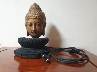 Buddha figurine with lamp