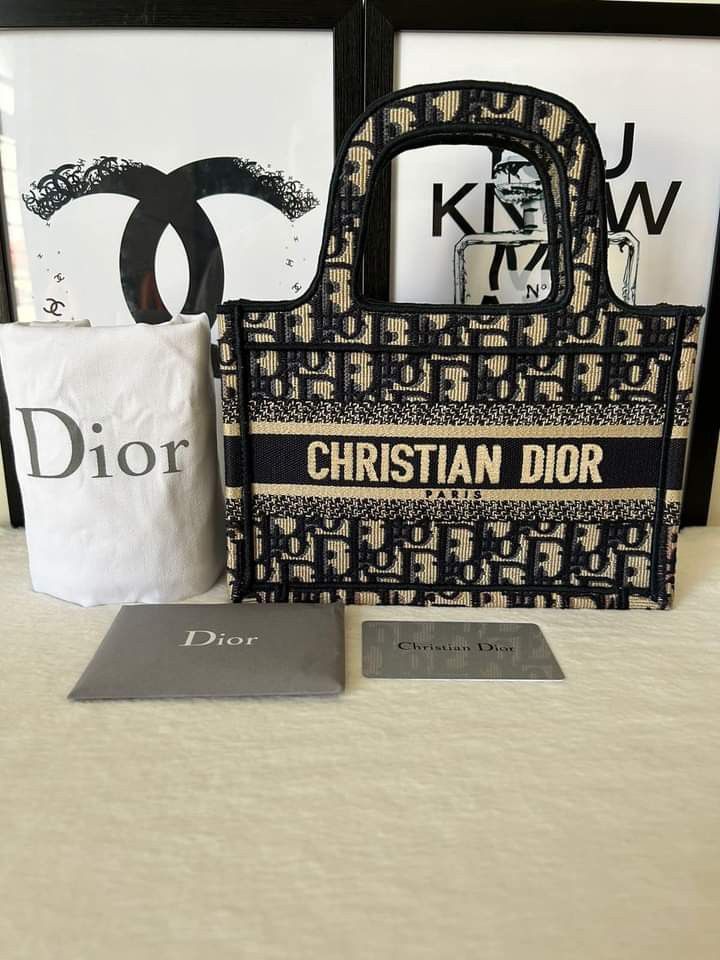 Dior Mini Book Tote (2020) (Category: Luxury Bags & Wallets) located in Manila. Submitted by bagislifeshop (Listing ID 1243881757, Image 1). Description: ▪️Dior Mini Book Tote (2020)▪️ ☑️Available in Pampanga ✅Condition: 9/10 ✅Material: Blue Dior Oblique Embroidery ✅Size: 22.5 x 15 x 6 cm ✅Inclusion: Dustbag, authenticity card and booklet.
