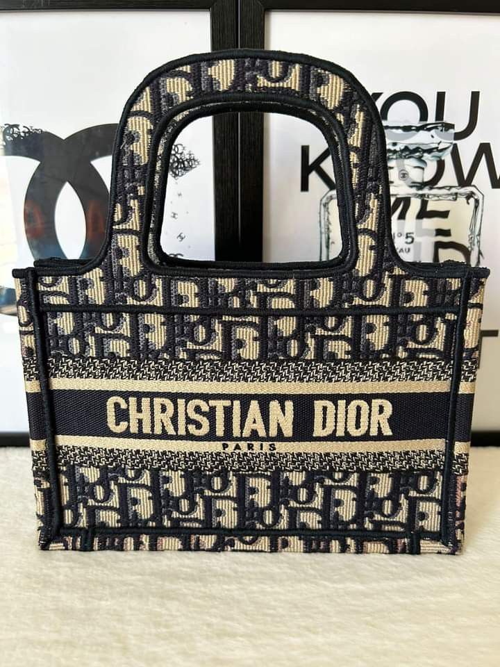 Dior Mini Book Tote (2020) (Category: Luxury Bags & Wallets) located in Manila. Submitted by bagislifeshop (Listing ID 1243881757, Image 2). Description: ▪️Dior Mini Book Tote (2020)▪️ ☑️Available in Pampanga ✅Condition: 9/10 ✅Material: Blue Dior Oblique Embroidery ✅Size: 22.5 x 15 x 6 cm ✅Inclusion: Dustbag, authenticity card and booklet.
