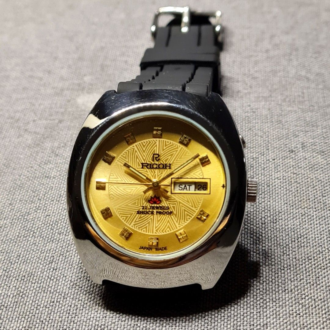 Golden Ricoh Watch - Automatic - Japan Made (Category: Luxury Watches) located in Caloocan City. Submitted by allig8 (Listing ID 1243878505, Image 2). Description: Very beautiful Automatic Watch Ricoh - Made in Japan 21 Jewels Bumpy Black Rubber Jelly Strap Diameter 39.4 mm Thick Watch Keeps good time At least 18 hours power reserve Selling for 3.5K only!!! WYSIWYG Please be reminded that you are not buying a brand new watch, so don't expect it t