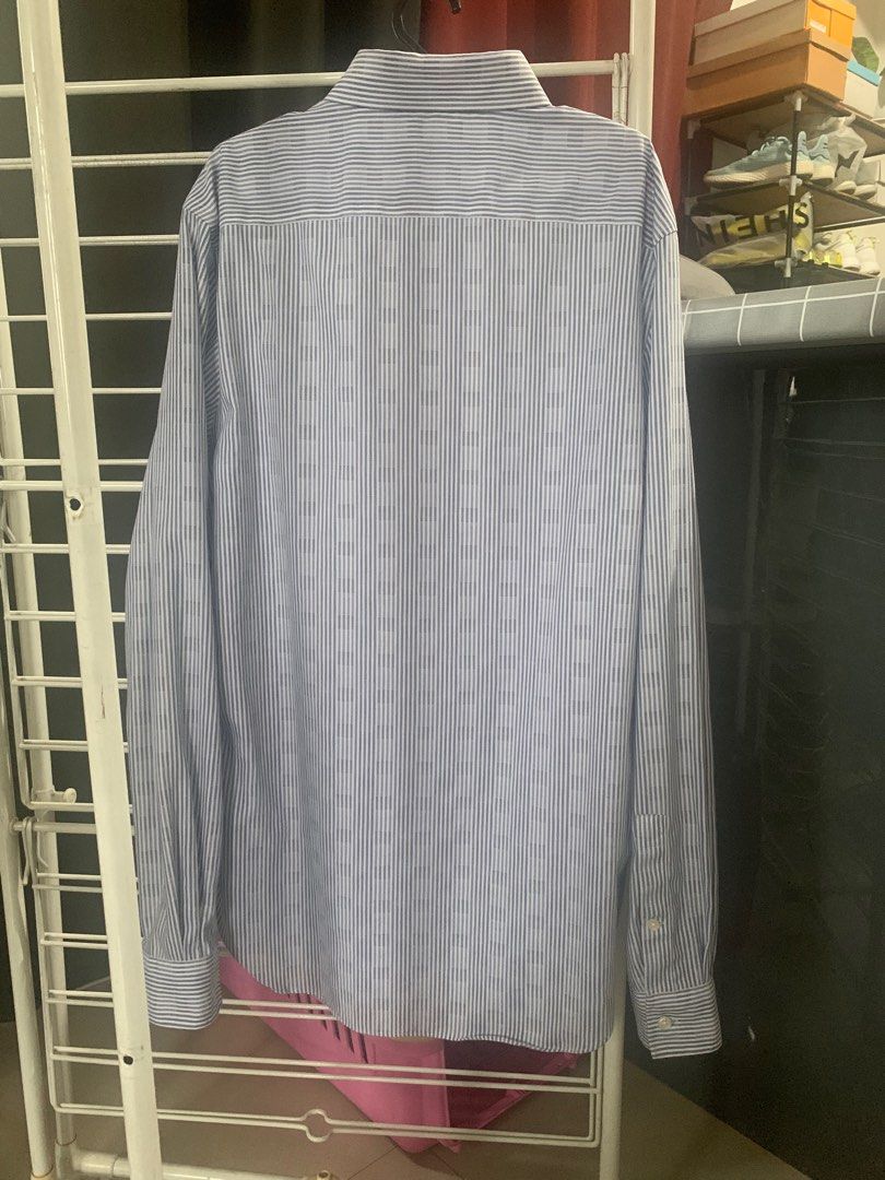 Michael Kors Blue stripes Longsleeve (Category: Formal Shirts) located in Quezon City. Submitted by deamyclutter (Listing ID 1243850995, Image 3). Description: Pre-loved 🥰 Size: M. 15 1/2. Slim Fit Length: 71cm Chest: 53 cm - no original packaging - expect some signs of usage .