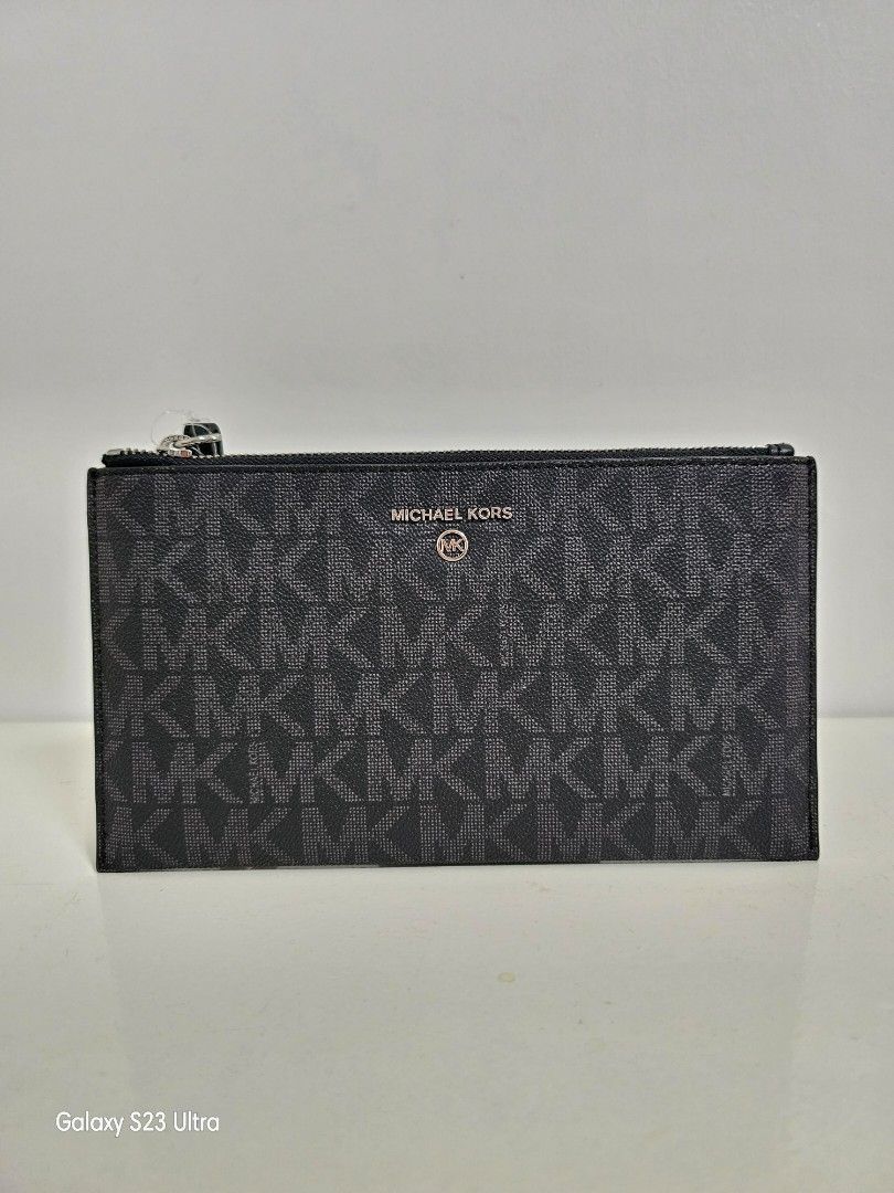 MK Wristlet Clutch Black Mono (Category: Luxury Bags & Wallets) located in Bulacan. Submitted by fazzauthenticgoods (Listing ID 1243770850, Image 1). Description: auth bnew with card slots 8.