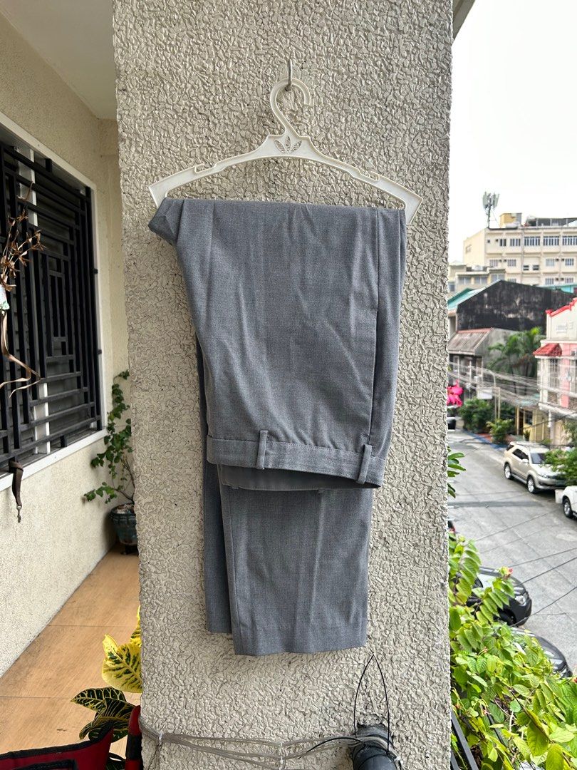 Uniqlo gray trousers smart pants (Category: Trousers) located in Manila. Submitted by mango.supply (Listing ID 1243800913, Image 1). Description: Altered to baston fit Great condition XL Price plus sf.