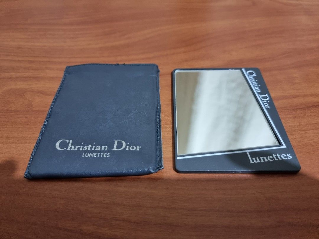 Christian Dior Lunettes Compact Mirror (Category: Face Care) located in Binangonan. Submitted by caaaris (Listing ID 1244030922, Image 1). Description: Christian Dior Lunettes Compact Mirror Comes with a soft sleeve case Authentic With minor signs of use, scuffs and scratches With brown marks caused by moisture in between the layer of silver and the backing material. The marks can be seen in the pictures Minor stitching issue at the top of the sl