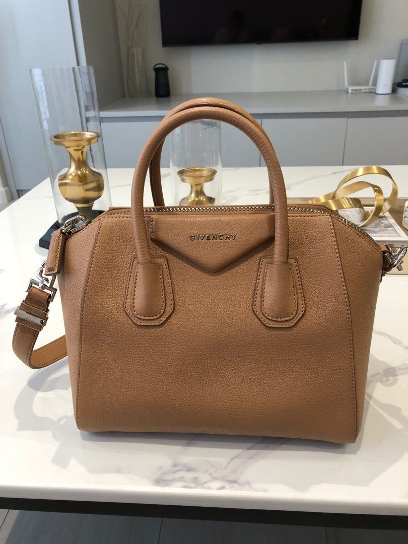 Givenchy Antigona Small (Category: Luxury Bags & Wallets) located in Manila. Submitted by joanne727 (Listing ID 1243970861, Image 1). Description: Givenchy Model: Antigona Size: small Color: tan Material: grained leather Inclusion: tag and dust bag Condition: used just once, in very condition just slight discoloration at the back handle of the bag as seen in the last pic but not that visible. Rest no damage or flaw. Looks very new RFS: too many b