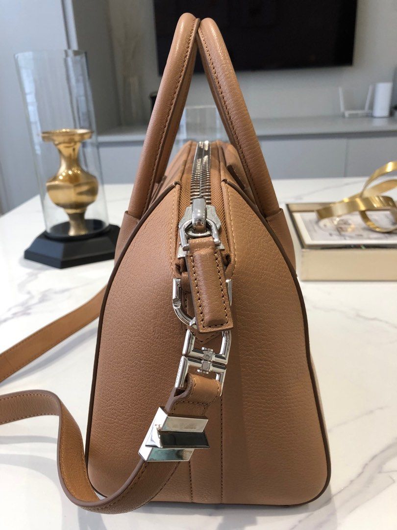 Givenchy Antigona Small (Category: Luxury Bags & Wallets) located in Manila. Submitted by joanne727 (Listing ID 1243970861, Image 3). Description: Givenchy Model: Antigona Size: small Color: tan Material: grained leather Inclusion: tag and dust bag Condition: used just once, in very condition just slight discoloration at the back handle of the bag as seen in the last pic but not that visible. Rest no damage or flaw. Looks very new RFS: too many b