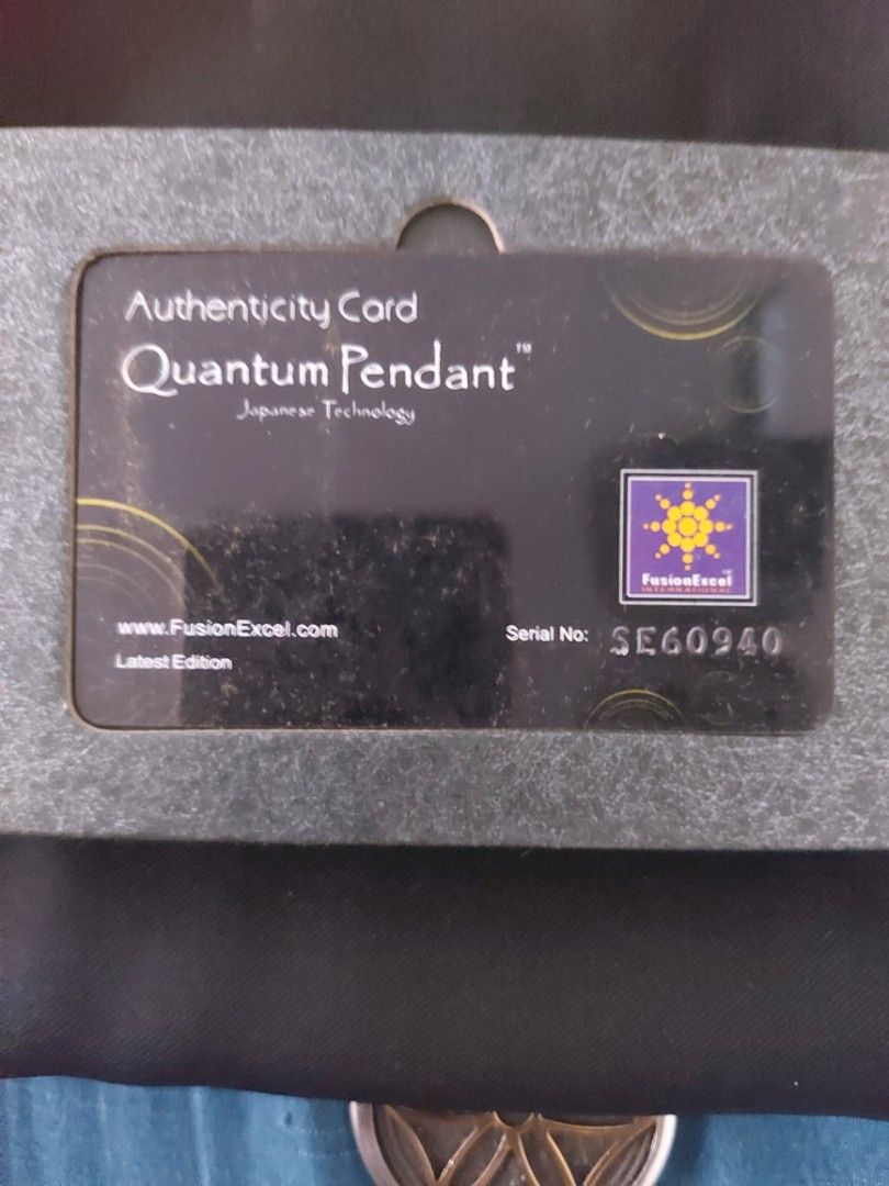 Quantum pendant (Category: Luxury Accessories) located in Las Pinas. Submitted by tigergemini (Listing ID 1243916933, Image 2). Description: with holder na po worth 2k di na po ginamit naka stock lang . complete eith box and authenticity card. RFS ; decluttering.