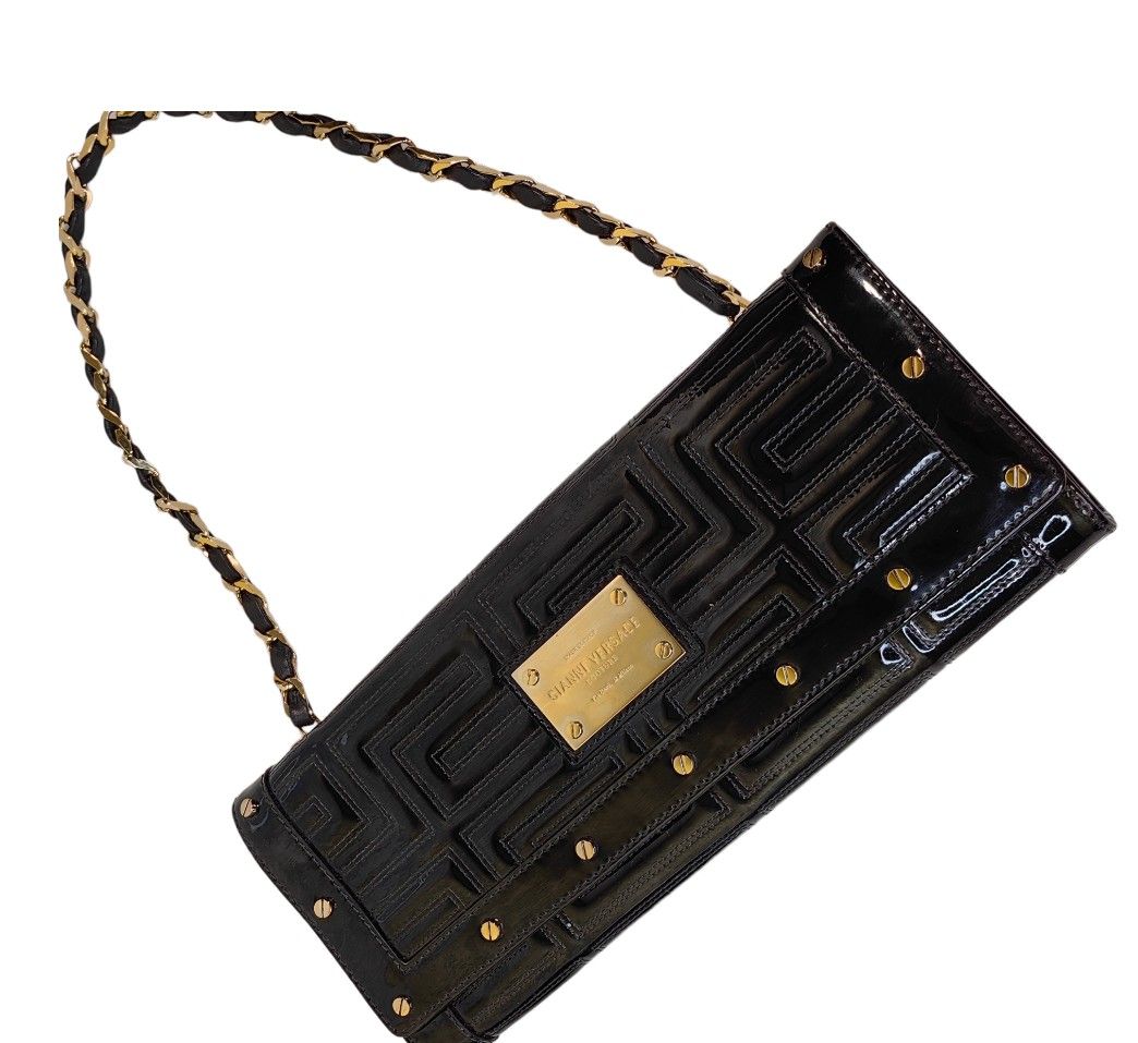 Authentic VERSACE Clutch shoulder bag (Category: Luxury Bags & Wallets) located in Quezon City. Submitted by manerarestorationservices (Listing ID 1238883987, Image 2). Description: Money back Guarantee 💯% Guaranteed authentic *Brand: Gianni Versace studed clutch baguette bag *Materials: patent leather *Color: black *Size: small *Condition: 8.5/10 slightly used pls,see photos -Used * Inclusions: dustbag Rank review by the criterion of our shop a