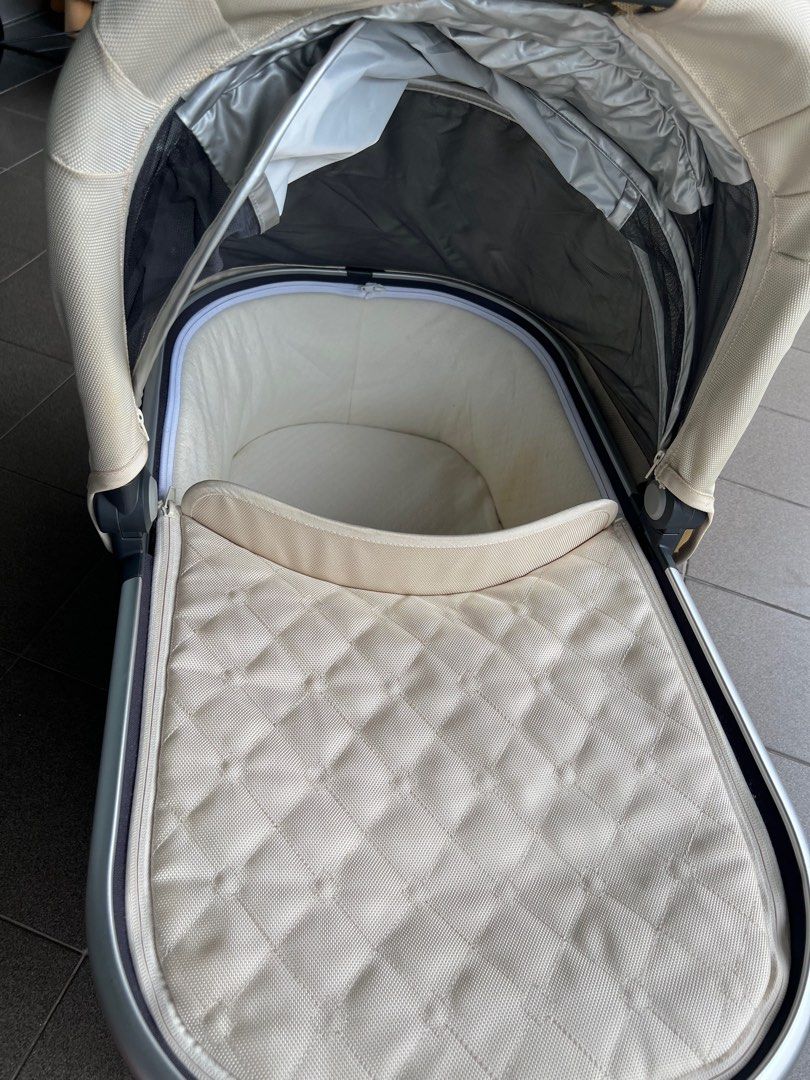 Baby sleeping in uppababy bassinet store