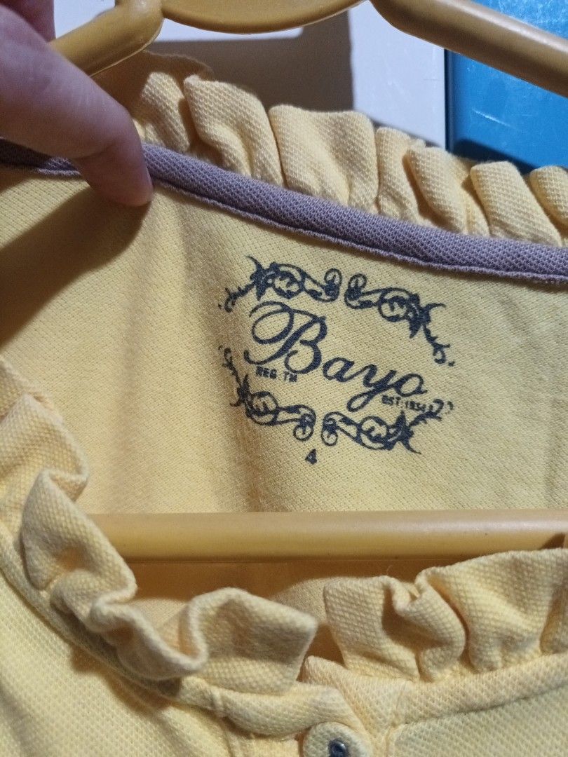 BAYO Ruffle Neck Polo Shirt (Category: Blouses) located in Quezon City. Submitted by aryv07 (Listing ID 1240720766, Image 3). Description: Size 4 (XL) on tag.
