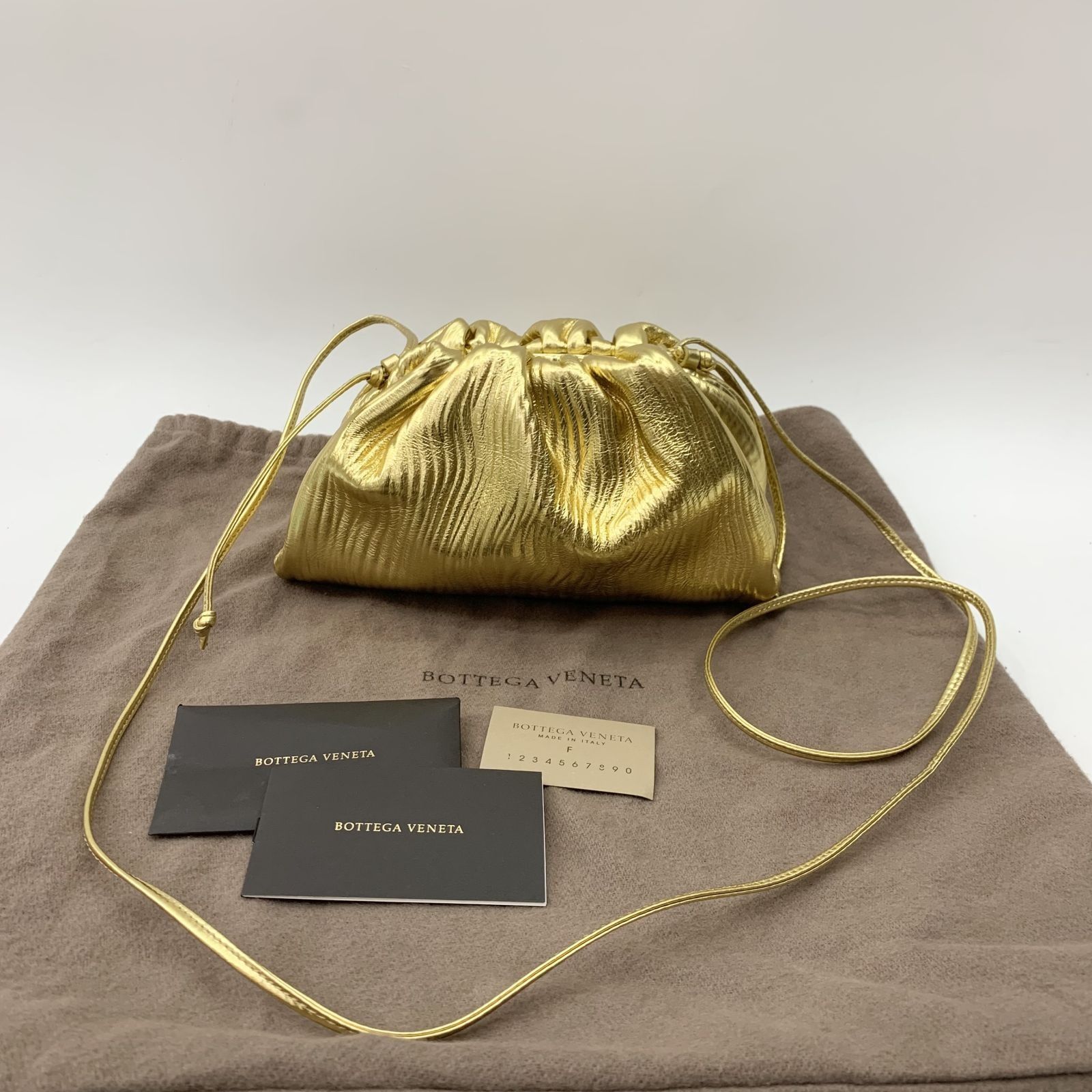 Gold best sale pouch bag