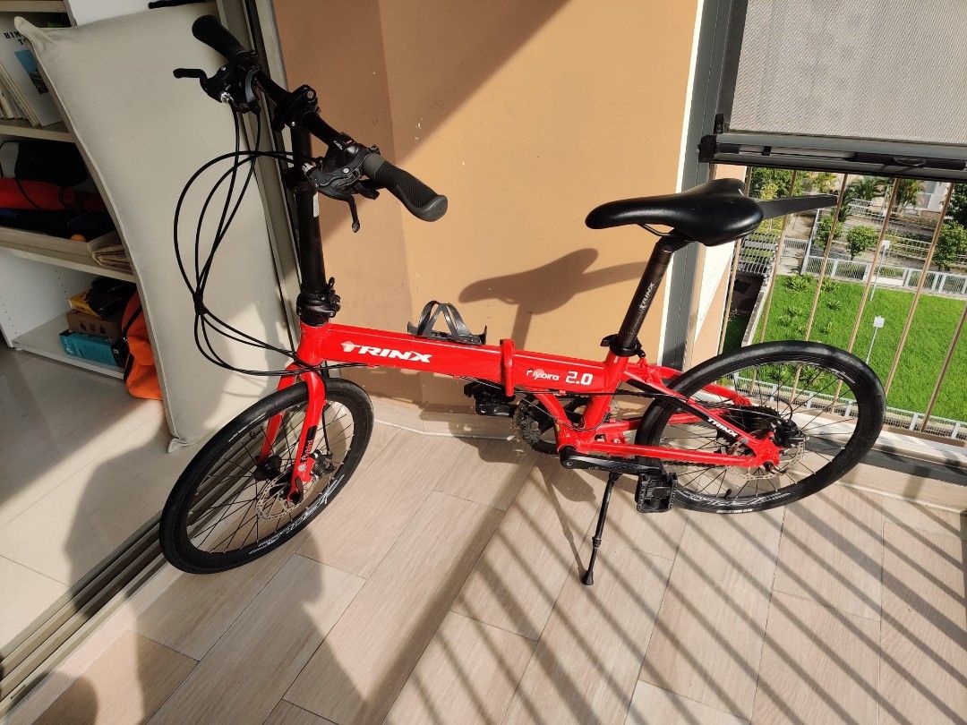 Trinx folding bike for sale deals