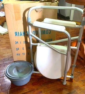 Adult commode , brand new but damaged box