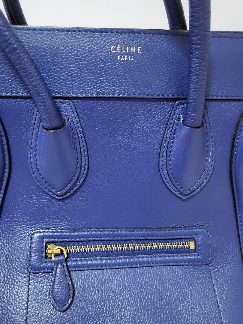 Celine Mini luggage in Coblat blue (Category: Bags & Wallets) located in Singapore. Submitted by shoe_lover (Listing ID 1244170495, Image 3). Description: 100% Authentic Excellent condition Bought from another Carousell seller Hardly used it - as good as new! Mini version - can fit MacBook Pro (14-inch) Slight stretch on one handle and bottom (not visible) Selling due to underutilized -Material: Leather -Colour: Coblat blue -Hardware: Gold -Inter