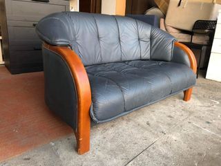 Leather sofa with solid wood accent  51L x 30W x 15H seat height inches Sandalan height 29 inches In good condition