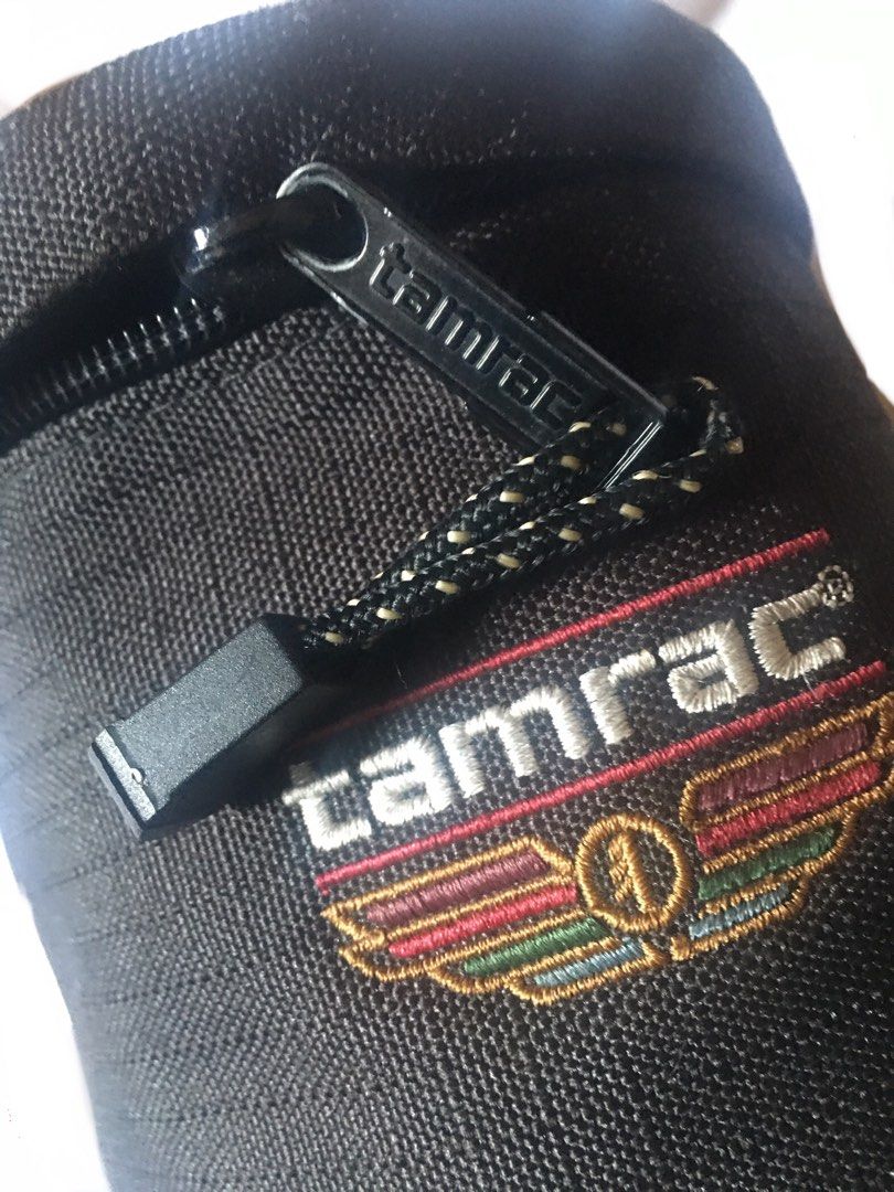 Tamrac 1999 XLarge Lens case (Category: Camera Bags & Carriers) located in Taguig. Submitted by Saint22 (Listing ID 1244118782, Image 2). Description: Used Tamrac 1999 XLarge Lens case, foam padded zip top, compatible with lenses UP to 8.5 inches long with a filter size of 77mm, issue the attachment at the back is cut divided into two in order to be attached to a Molle vest. Tamrac code MX 5379.