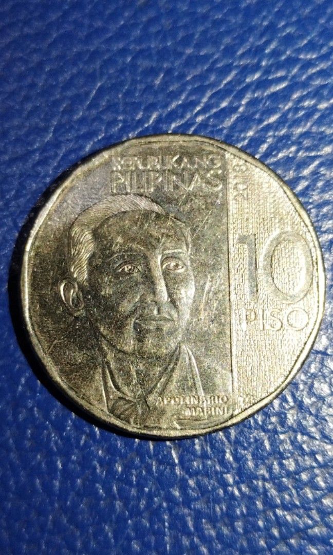 Apolinario Mabini 10 Peso Error Coin (Category: Currency) located in Caloocan City. Submitted by all_antiques_preloved (Listing ID 1244554552, Image 2). Description: ☑️ Reverse side of coin has Excess metal as seen in the first picture. ☑️ Can still provide photos upon request po.😊 P.S. Please check out my page here sa Carousell❤️ thank y'all! ❤️ ❇️ Lahat po ng ANTIQUE/VINTAGE ITEMS dito ay from our lola's & some from our great grandparents pa p
