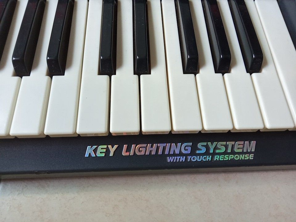 Casio piano keyboard with key lighting system with touch response