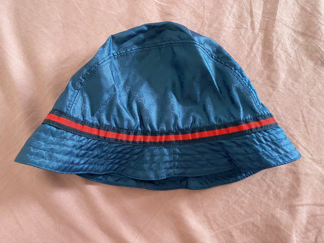 Gucci Kids Blue Bucket Hat (Category: Babies & Kids Fashion) located in San Juan City. Submitted by 11_mallow (Listing ID 1244702209, Image 3). Description: Gucci Kids Blue Bucket Hat GG Print Navy/red web print Size: L Very good condition Refer to photo for measurement Pick-up c/o buyer only RFS: Outgrown.