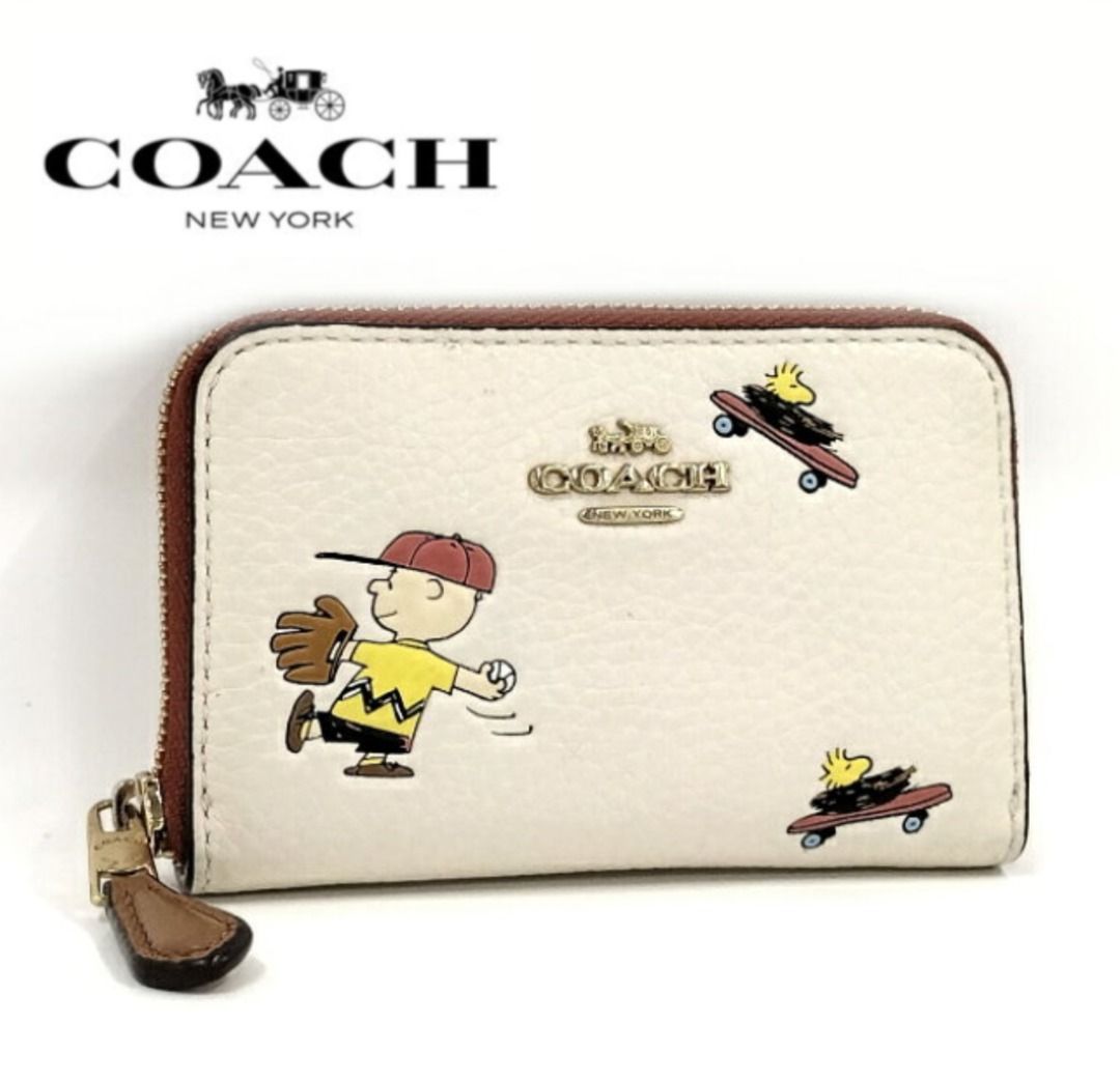 COACH®  Coach X Peanuts Round Coin Case In Signature Canvas With Snoopy  Presents Print