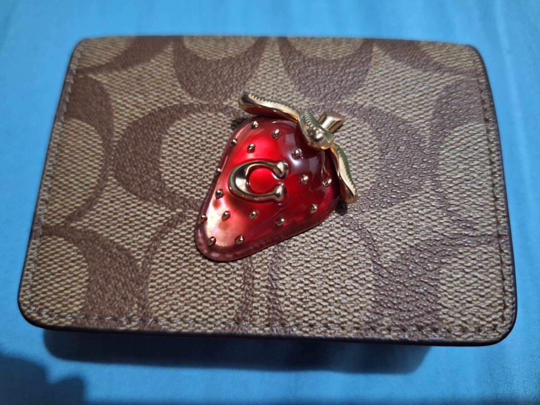 Original coach strawberry sling wallet on Carousell