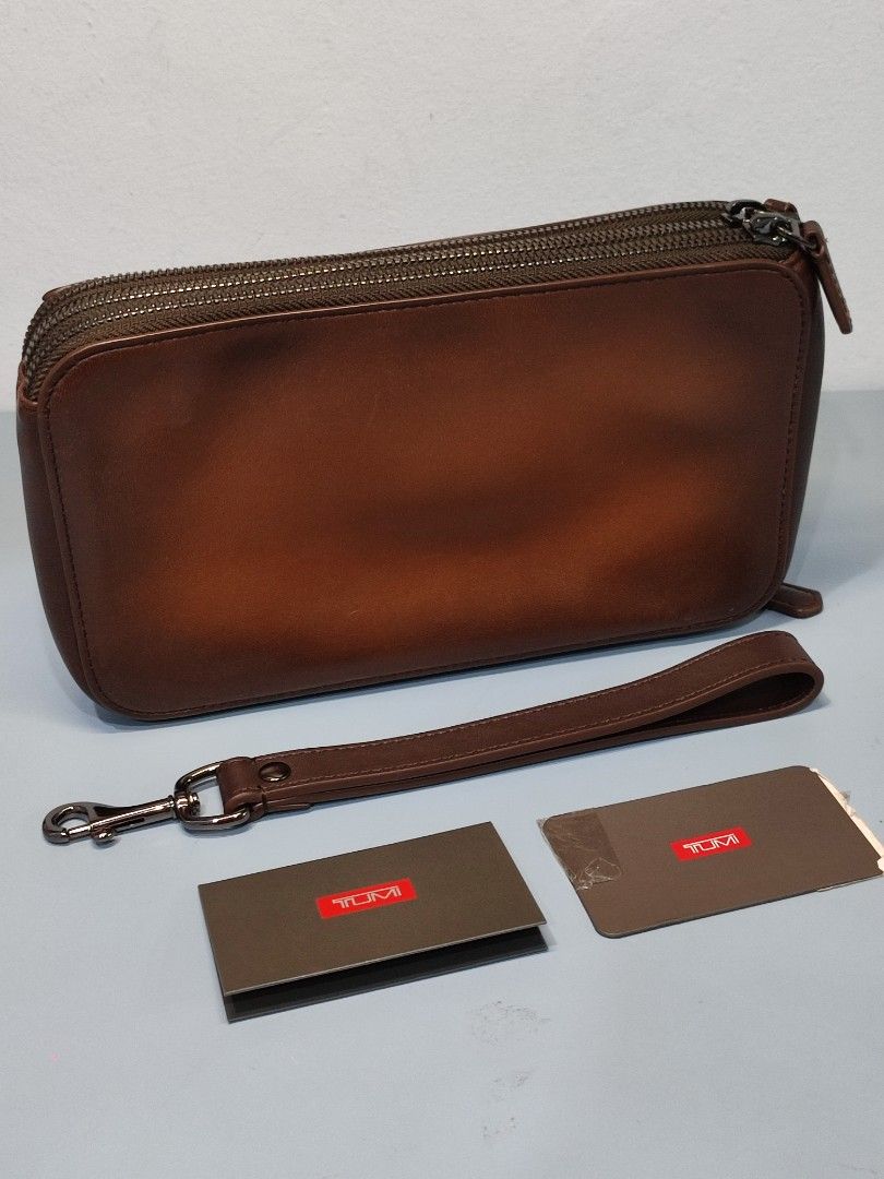 Tumi nassau on sale triple zip clutch