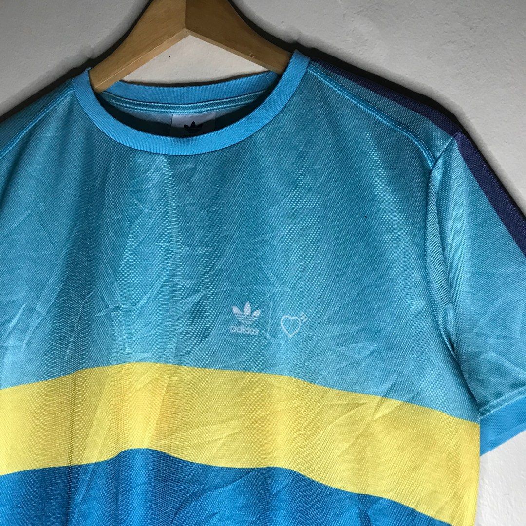 Remera adidas pharrell williams discount
