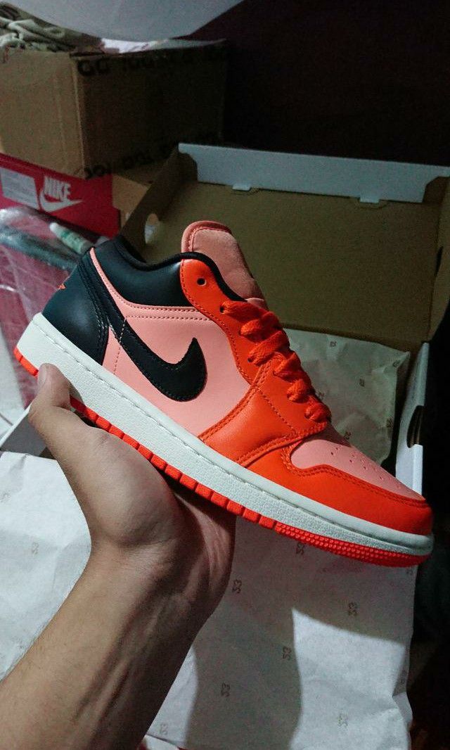 black and orange jordan 1 low