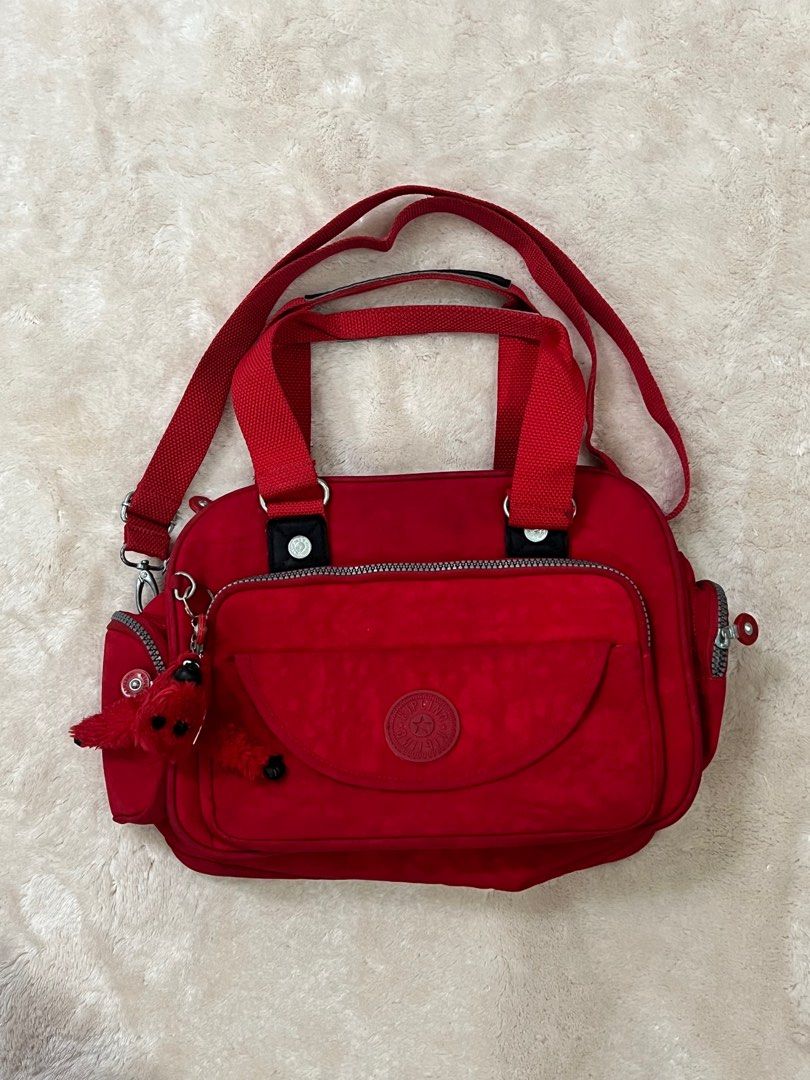 AUTHENTIC KIPLING SHOULDER BAG IN RED (Category: Shoulder Bags) located in Quezon City. Submitted by mendezcha68020 (Listing ID 1244884382, Image 1). Description: Authentic Kipling bag, no issues. LP 1500, bought at duty free..