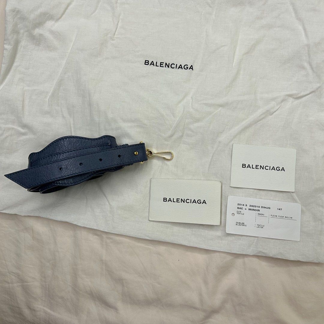 Balenciaga Classic City Bag (Category: Luxury Bags & Wallets) located in Quezon City. Submitted by bray_ (Listing ID 1244941675, Image 3). Description: Blue leather with gold-tone studs Very good condition With authenticity card and dust bag W 36 H 24 D 14 cm Handle drop 12cm Shoulder strap 26cm removable.