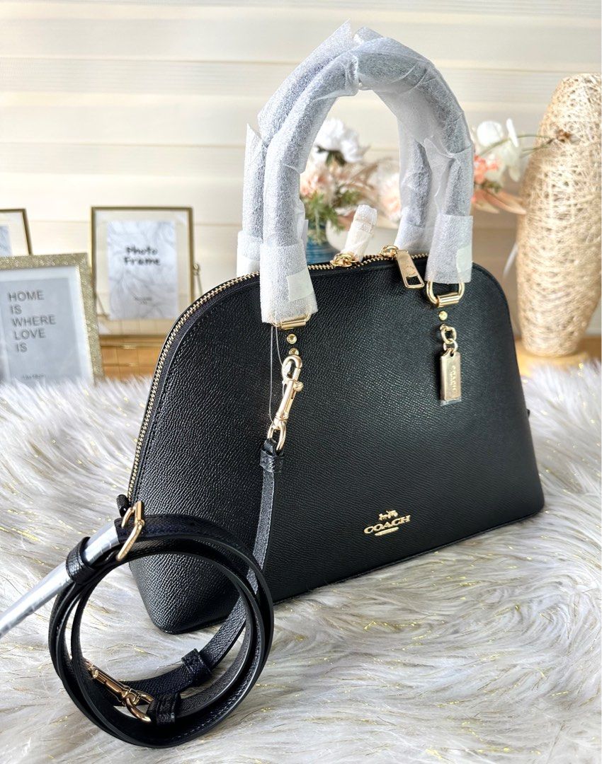 Coach Katy Satchel (Category: Luxury Bags & Wallets) located in Mandaluyong City. Submitted by shop_0n_the_spot (Listing ID 1244912701, Image 2). Description: 💯% GUARANTEED ORIGINAL & BRAND NEW. Katy Satchel Product Details: Crossgrain leather Inside zip pocket Zip closure, fabric lining Handles with 3 3/4” drop Outside zip pocket Detachable strap with 22” drop for shoulder or crossbody wear Four protective feet at base 11 3/4” (L) x 7 3/4” (H) 