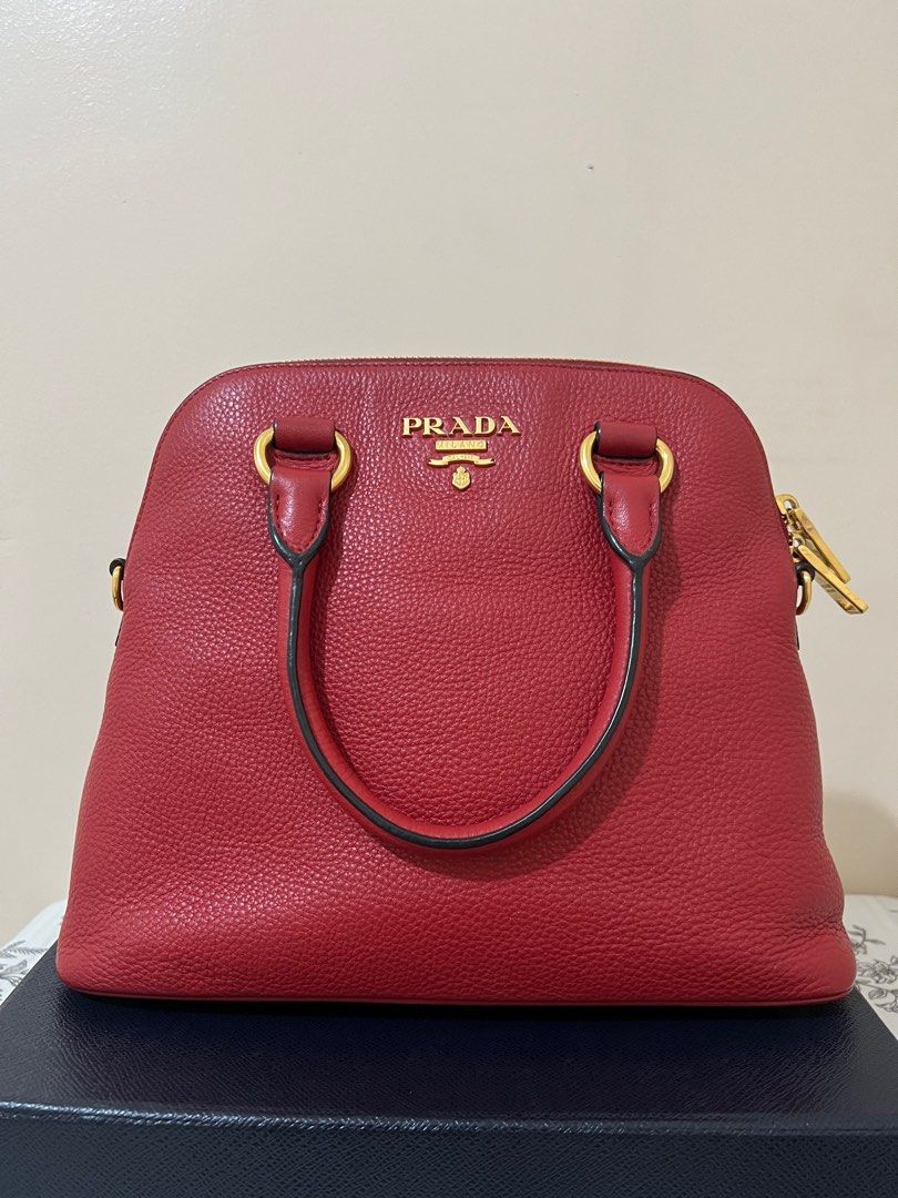 Sale‼️Prada Dome Bag (Category: Luxury Bags & Wallets) located in Tacloban City. Submitted by luxebagstorebyrgdc (Listing ID 1244971056, Image 2). Description: With box, dust bag and strap Excellent condition 9/10 💯% Authentic Money back guarantee Accept 3months layaway (pm for more details).
