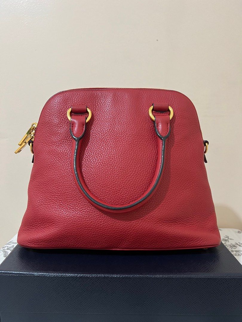 Sale‼️Prada Dome Bag (Category: Luxury Bags & Wallets) located in Tacloban City. Submitted by luxebagstorebyrgdc (Listing ID 1244971056, Image 3). Description: With box, dust bag and strap Excellent condition 9/10 💯% Authentic Money back guarantee Accept 3months layaway (pm for more details).