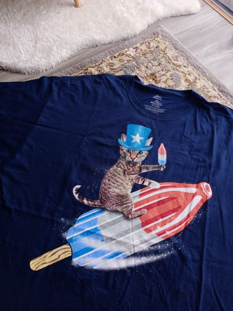 Cat riding a bomb pop shirt top