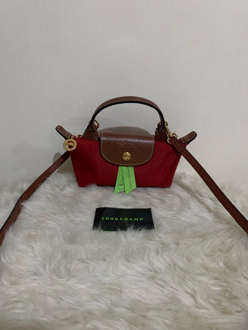 original longchamp mini pouch with sling (Category: Luxury Bags & Wallets) located in Cabuyao City. Submitted by luxbymishy (Listing ID 1245083262, Image 2). Description: authentic brand new complete inclusions .
